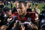 SAN DIEGO, CA - DECEMBER 30: Ndamukong Suh #93 of the University of Nebraska Cornhuskers speaks to media after his team's 33-0 victory against the University of Arizona Wildcats during the Pacific Life Holiday Bowl, on December 30, 2009 at Qualcomm Stadium in San Diego, California. (Photo By Donald Miralle/Getty Images)