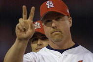 12 Oct 2001: Mark McGwire #25 of the St.Louis Cardinals salutes the crowd during team introductions before their game against the Arizona Diamondbacks at Busch Stadium in St. Louis, Missouri. DIGITAL IMAGE. Mandatory Credit: Elsa/ALLSPORT