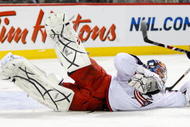 MONTREAL- NOVEMBER 24:  Mathieu Garon #32 of the Columbus Blue Jackets stretches out to poke check Benoit Pouliot #67 of the Montreal Canadiens during the NHL game on November 24, 2009 at the Bell Centre in Montreal, Quebec, Canada.  The Canadiens defeated the Blue Jackets 5-3.  (Photo by Richard Wolowicz/Getty Images)