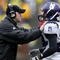 ANN ARBOR, MI - OCTOBER 28:  Head coach Pat Fitzgerald of the Northwestern Wildcats talks with Kevin Mitchell #24 during a game against the Michigan Wolverines on October 28, 2006 at Michigan Stadium in Ann Arbor, Michigan. Michigan defeated Northwestern 17-3.  (Photo by Gregory Shamus/Getty Images)