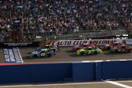 FONTANA, CA - OCTOBER 11: Jimmie Johnson, driver of the #48 Lowe's/Jimmie Johnson Foundation Chevrolet, leads the field at the final restart of the NASCAR Sprint Cup Series Pepsi 500 at Auto Club Speedway on October 11, 2009 in Fontana, California. (Photo by Stephen Dunn/Getty Images for NASCAR)