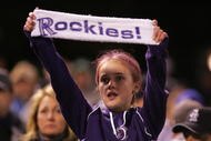 DENVER - OCTOBER 15: A young fan of the Colorado Rockies holds up a sign in supprt of her team against the Arizona Diamondbacks during Game Four of the National League Championship Series at Coors Field on October 15, 2007 in Denver, Colorado. The Rockies defeated the Diamondbacks 6-4 to sweep the series 4-0. (Photo by Doug Pensinger/Getty Images)