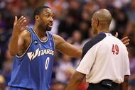 PHOENIX - DECEMBER 19: Gilbert Arenas #0 of the Washington Wizards reacts to a call from referee Tom Washington during the NBA game against the Phoenix Suns at US Airways Center on December 19, 2009 in Phoenix, Arizona. NOTE TO USER: User expressly acknowledges and agrees that, by downloading and or using this photograph, User is consenting to the terms and conditions of the Getty Images License Agreement. (Photo by Christian Petersen/Getty Images)