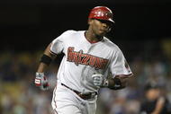 LOS ANGELES - AUGUST 31: Justin Upton #10 of the Arizona Diamondbacks runs to first on his game tying home run in the eighth inning against the Los Angeles Dodgers on August 31, 2009 at Dodger Stadium in Los Angeles, California. (Photo by Stephen Dunn/Getty Images)
