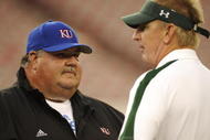 TAMPA, FL - SEPTEMBER 12: Coach Mark Mangino of the Kansas Jayhawks and coach Jim Leavitt of the South Florida Bulls talk before play at Raymond James Stadium on September 12, 2008 in Tampa, Florida. (Photo by Al Messerschmidt/Getty Images)