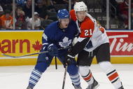 LONDON, ON - SEPTEMBER 17:  Tyler Bozak #42 of the Toronto Maple Leafs battles with James Van Reimsdyk #21 of the Philadelphia Flyers in a preseason game on September 17, 2009 at the John Labatt Centre in London, Ontario. The Leafs defeated the Flyers 4-0. (Photo by Claus Andersen/Getty Images)