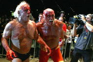 PERTH, AUSTRALIA - NOVEMBER 24:  Hulk Hogan guides Rick Flair back to the ring during the Hulkamania Tour at the Burswood Dome on November 24, 2009 in Perth, Australia.  (Photo by Paul Kane/Getty Images)
