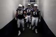 SAN DIEGO, CA - JANUARY 3:  Kris Dielman #68, Dennis Norman #64, and Nick Hardwick #61 of the San Diego Chargers enter the field against the Washington Redskins during the Washington Redskins  v San Diego Chargers NFL Game on January 3, 2010 at Quolcomm Stadium in San Diego, California. The Chargers won 23-20. (Photo by Donald Miralle/Getty Images)