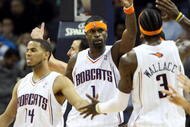 CHARLOTTE, NC - JANUARY 15:  Stephen Jackson #1 celebrates with teammates D.J. Augustin #14 and Gerald Wallace #3 of the Charlotte Bobcats during their game against the San Antonio Spurs at Time Warner Cable Arena on January 15, 2010 in Charlotte, North Carolina. NOTE TO USER: User expressly acknowledges and agrees that, by downloading and/or using this Photograph, User is consenting to the terms and conditions of the Getty Images License Agreement.  (Photo by Streeter Lecka/Getty Images)