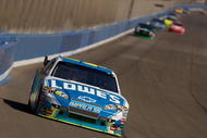 FONTANA, CA - OCTOBER 11:  Jimmie Johnson, driver of the #48 Lowe's Chevrolet, leads the field during the NASCAR Sprint Cup Series Pepsi 500 at Auto Club Speedway on October 11, 2009 in Fontana, California.  (Photo by Chris Graythen/Getty Images)