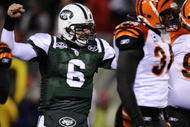 EAST RUTHERFORD, NJ - JANUARY 03:  Mark Sanchez #6 of the New York Jets celebrates a touchdown by Thomas Jones #20 in the first quarter  against the Cincinnati Bengals at Giants Stadium on January 3, 2010 in East Rutherford, New Jersey.  (Photo by Jeff Zelevansky/Getty Images)