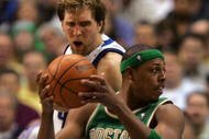 DALLAS - MARCH 20: Paul Pierce #34 of the Boston Celtics looks to pass against Dirk Nowitzki #21 of the Dallas Mavericks on March 20, 2008 at American Airlines Center in Dallas, Texas. NOTE TO USER: User expressly acknowledges and agrees that, by downloading and/or using this Photograph, user is consenting to the terms and conditions of the Getty Images License Agreement. (Photo by Ronald Martinez/Getty Images)