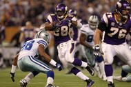 MINNEAPOLIS - JANUARY 17:  Running back Adrian Peterson #28 of the Minnesota Vikings runs the ball against Ken Hamlin #26 of the Dallas Cowboys during the second quarter of the NFC Divisional Playoff Game at Hubert H. Humphrey Metrodome on January 17, 2010 in Minneapolis, Minnesota.  (Photo by Chris McGrath/Getty Images)