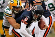 CHICAGO - DECEMBER 13: Clay Matthews #52 of the Green Bay Packers sacks Jay Cutler #6 of the Chicago Bears at Soldier Field on December 13, 2009 in Chicago, Illinois. The Packers defeated the Bears 21-14. (Photo by Jonathan Daniel/Getty Images)