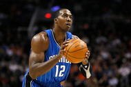 PHOENIX - DECEMBER 11: Dwight Howard #12 of the Orlando Magic shoots a free throw shot during the NBA game against the Phoenix Suns at US Airways Center on December 11, 2009 in Phoenix, Arizona. The Suns defeated the Magic 106-103. NOTE TO USER: User expressly acknowledges and agrees that, by downloading and or using this photograph, User is consenting to the terms and conditions of the Getty Images License Agreement. (Photo by Christian Petersen/Getty Images)