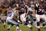MINNEAPOLIS - JANUARY 17:  Running back Adrian Peterson #28 of the Minnesota Vikings runs the ball against Ken Hamlin #26 of the Dallas Cowboys during the second quarter of the NFC Divisional Playoff Game at Hubert H. Humphrey Metrodome on January 17, 2010 in Minneapolis, Minnesota.  (Photo by Chris McGrath/Getty Images)
