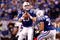 INDIANAPOLIS - JANUARY 16:  Quarterback Peyton Manning #18 of the Indianapolis Colts looks to throw the ball against the Baltimore Ravens during the AFC Divisional Playoff Game at Lucas Oli Stadium on January 16, 2010 in Indianapolis, Indiana.  (Photo by Andy Lyons/Getty Images)
