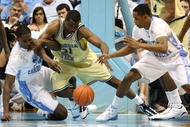 CHAPEL HILL, NC - JANUARY 16:  Gani Lawal #31 of the Georgia Tech Yellow Jackets battles for a loose ball with teammates Ed Davis #32 and Larry Drew II #11 of the North Carolina Tar Heels during their game at the Dean Smith Center on January 16, 2010 in Chapel Hill, North Carolina.  (Photo by Streeter Lecka/Getty Images)