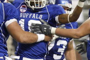 DETROIT - DECEMBER 05: James Starks #19 of the Buffalo Bulls celebrates a fourth quarter touchdown with Chris Lauzze #79, Andrew West #72 and Peter Bittner #73 while playing the Ball State Cardinals during the second quarter of the MAC Championship game on December 5, 2008 at Ford Field in Detroit, Michigan. (Photo by Gregory Shamus/Getty Images)