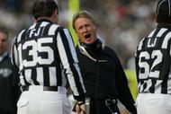 6 Jan 2002:  Head coach Jon Gruden of the Oakland Raiders talks to an official during the game against the New York Jets at Network Associates Coliseum in Oakland, California. The Jets won 24-22. DIGITAL IMAGE. Mandatory  Credit : Jed Jacobsohn/Getty Images