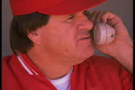 CINCINNATI REDS MANAGER PETE ROSE TALKS ON THE PHONE WHILE IN THE DUGOUT DURING THE REDS VERSUS CHICAGO CUBS GAME AT WRIGLEY FIELD IN CHICAGO, ILLINOIS. MANDATORY CREDIT: JONATHAN DANIEL/ALLSPORT US