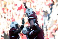 COLUMBIA, SC - NOVEMBER 28: Stephen Garcia #5 of the South Carolina Gamecocks celebrates a second half touchdown with his temmates against the Clemson Tigers at Williams-Brice Stadium on November 28, 2009 in Columbia, South Carolina. (Photo by Scott Halleran/Getty Images)