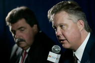 CONCORD, NC - JANUARY 21:  NASCAR Chairman and CEO Brian France (R) speaks with the media, as NASCAR President Mike Helton (L) looks on, during the NASCAR Sprint Media Tour hosted by Charlotte Motor Speedway, held at the NASCAR Research and Development Center on January 21, 2010 in Concord, North Carolina.  (Photo by Jason Smith/Getty Images)