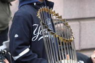 NEW YORK - NOVEMBER 06: Captain Derek Jeter #2 of the New York Yankees celebrates with the championship trophy during the New York Yankees World Series Victory Celebration at City Hall on November 6, 2009 in New York, New York. (Photo by Jim McIsaac/Getty Images)