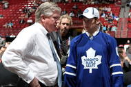 MONTREAL, QC - JUNE 27:  Kenny Ryan speaks to General Manager Brian Burke of the Toronto Maple Leafs organization after he was drafted by the Leafs in the second round during the 2009 NHL Entry Draft at the Bell Centre on June 27, 2009 in Montreal, Quebec, Canada. (Photo by Bruce Bennett/Getty Images) 