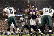 MINNEAPOLIS - JANUARY 04:   Donovan McNabb #5 of the Philadelphia Eagles passes the ball under pressure from Brian Robison #96 of the Minnesota Vikings during the NFC Wild Card playoff game on January 4, 2009 at the Hubert H. Humphrey Metrodome in Minneapolis, Minnesota. The Eagles defeated the Vikings 26-14.(Photo by Elsa/Getty Images)