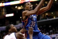 LOS ANGELES, CA - NOVEMBER 11:  Kevin Durant #35 of the Oklahoma City Thunder goes up fora shot over Al Thornton #12 of the Los Angeles Clippers on November 11, 2009 at Staples Center in Los Angeles, California.    NOTE TO USER: User expressly acknowledges and agrees that, by downloading and/or using this Photograph, user is consenting to the terms and conditions of the Getty Images License Agreement.  (Photo by Stephen Dunn/Getty Images)