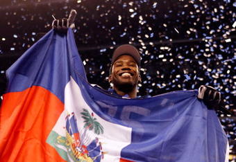 INDIANAPOLIS - JANUARY 24:  Wide receiver Pierre Garcon #85 of the Indianapolis Colts celebrates with the Haitian flag after the Colts defeated the New York Jets 30-17 in the AFC Championship Game at Lucas Oil Stadium on January 24, 2010 in Indianapolis, Indiana.  (Photo by Elsa/Getty Images)
