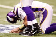 NEW ORLEANS - JANUARY 24: Quarterback Brett Favre #4 of the Minnesota Vikings kneels on the turf in pain after he took a hard hit against the New Orleans Saints during the NFC Championship Game at the Louisiana Superdome on January 24, 2010 in New Orleans, Louisiana. (Photo by Chris Graythen/Getty Images)