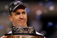 INDIANAPOLIS - JANUARY 24:  Quarterback Peyton Manning #18 of the Indianapolis Colts celebrates with the Lamar Hunt Trophy after defeating the New York Jets 30-17 during the AFC Championship Game at Lucas Oil Stadium on January 24, 2010 in Indianapolis, Indiana.  (Photo by Jonathan Daniel/Getty Images)