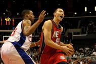 LOS ANGELES - JANUARY 18:  Jianlian Yiu #9 of the New Jersey Nets drives against Marcus Camby #23 of the Los Angeles Clippers on January 18, 2010 at Staples Center in Los Angeles, California. The Clippers won 106-95.  NOTE TO USER: User expressly acknowledges and agrees that, by downloading and/or using this Photograph, user is consenting to the terms and conditions of the Getty Images License Agreement. (Photo by Stephen Dunn/Getty Images)