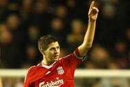 LIVERPOOL, ENGLAND - DECEMBER 26: Steven Gerrard of Liverpool celebrates scoring the opening goal during the Barclays Premier League match between Liverpool and Wolverhampton Wanderers at Anfield on December 26, 2009 in Liverpool, England. (Photo by Clive Brunskill/Getty Images)