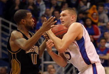 LAWRENCE, KS - JANUARY 25:  Zaire Taylor #11 of the Missouri Tigers wrestles for a loose ball with Cole Aldrich #45 of the Kansas Jayhawks during the game on January 25, 2010 at Allen Fieldhouse in Lawrence, Kansas.  (Photo by Jamie Squire/Getty Images)