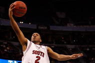 TAMPA, FL - MARCH 13:  Devan Downey #2 of the South Carolina Gamecocks makes a layup around Dee Bost #3 of the Mississippi State Bulldogs during the quaterfinal round of the SEC Men's Basketball Tournament on March 13, 2009 at The St. Pete Times Forum in Tampa, Florida.  (Photo by Chris Graythen/Getty Images)