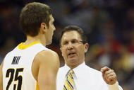 KANSAS CITY, MO - NOVEMBER 23:  Head coach Todd Lickliter of the Iowa Hawkeyes talks with Eric May #25 against the Texas Longhorns during the CBE Classic semifinal game on November 23, 2009 at Sprint Center in Kansas City, Missouri. (Photo by: Jamie Squire/Getty Images)