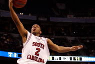TAMPA, FL - MARCH 13:  Devan Downey #2 of the South Carolina Gamecocks makes a layup around Dee Bost #3 of the Mississippi State Bulldogs during the quaterfinal round of the SEC Men's Basketball Tournament on March 13, 2009 at The St. Pete Times Forum in Tampa, Florida.  (Photo by Chris Graythen/Getty Images)