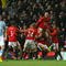 MANCHESTER, ENGLAND - JANUARY 27:  Michael Carrick of Manchester United celebrates scoring his team's second goal with Wayne Rooney and his team mates during the Carling Cup Semi Final second leg match between Manchester United and Manchester City at Old Trafford on January 27, 2010 in Manchester, England.  (Photo by Alex Livesey/Getty Images)