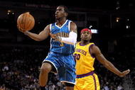 OAKLAND, CA - JANUARY 27: Chris Paul #3 of the New Orleans Hornets drives on Cartier Martin #20 of the Golden State Warriors at Oracle Arena on January 27, 2010 in Oakland, California. NOTE TO USER: User expressly acknowledges and agrees that, by downloading and/or using this Photograph, user is consenting to the terms and conditions of the Getty Images License Agreement. (Photo by Ezra Shaw/Getty Images)