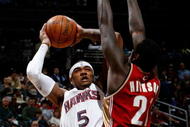 ATLANTA - DECEMBER 29: Josh Smith #5 of the Atlanta Hawks shoots against J.J. Hickson #21 of the Cleveland Cavaliers at Philips Arena on December 29, 2009 in Atlanta, Georgia. NOTE TO USER: User expressly acknowledges and agrees that, by downloading and/or using this Photograph, User is consenting to the terms and conditions of the Getty Images License Agreement. (Photo by Kevin C. Cox/Getty Images)