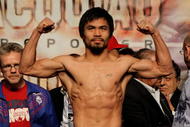 LAS VEGAS - NOVEMBER 13: Manny Pacquiao weighs in for his upcoming bout against WBO welterweight champion Miguel Cotto at the MGM Grand Garden Arena on November 13, 2009 in Las Vegas, Nevada. Pacquiao and Cotto will meet in a WBO welterweight title fight at the MGM Grand on November 14. Pacquiao weighed in at 144 pounds and Cotto weighed in at 145 pounds. (Photo by Al Bello/Getty Images)