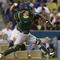 LOS ANGELES, CA - JUNE 16:  Kurt Suzuki #8 of the Oakland Athletics fields against the Los Angeles Dodgers at Dodger Stadium on June 16, 2009 in Los Angeles, California. The Dodgers defeated the Athletics 5-4 in ten innings.  (Photo by Jeff Gross/Getty Images)