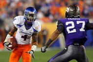 GLENDALE, AZ - JANUARY 04: Titus Young #4 of the Boise State Broncos runs after a catch against Jason Teague #27 of the TCU Horned Frogs during the Tostitos Fiesta Bowl at the Universtity of Phoenix Stadium on January 4, 2010 in Glendale, Arizona. (Photo by Christian Petersen/Getty Images)
