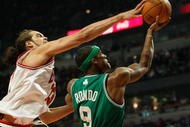 CHICAGO - DECEMBER 12: Joakim Noah #13 of the Chicago Bulls blocks a shot by Rajon Rondo #9 of the Boston Celtics at the United Center on December 12, 2009 in Chicago, Illinois. NOTE TO USER: User expressly acknowledges and agrees that, by downloading and/or using this Photograph, User is consenting to the terms and conditions of the Getty Images License Agreement. (Photo by Jonathan Daniel/Getty Images)
