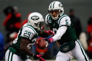 EAST RUTHERFORD, NJ - OCTOBER 18: Mark Sanchez #6 hands off the ball to Leon Washington #29 of the New York Jets against the Buffalo Bills during the game on October 18, 2009 at Giants Stadium in East Rutherford, New Jersey. (Photo by Jared Wickerham/Getty Images)