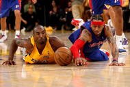 LOS ANGELES, CA - NOVEMBER 14: Kobe Bryant #24 of the Los Angeles Lakers and Allen Iverson #1 of the Detroit Pistons dive for a loose ball on November 14, 2008 at Staples Center in Los Angeles, California. The Pistons won 106-95.   NOTE TO USER: User expressly acknowledges and agrees that, by downloading and/or using this Photograph, user is consenting to the terms and conditions of the Getty Images License Agreement.  (Photo by Stephen Dunn/Getty Images)