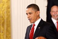 WASHINGTON - JANUARY 25:  President Barack Obama carries a basketball signed by members of the National Basketball Association 2009 champions Los Angeles Lakers during an event with the team in the East Room of the White House January 25, 2010 in Washington, DC. The Lakers bested the Orlando Magic to win the NBA Finals in 2009.  (Photo by Chip Somodevilla/Getty Images)